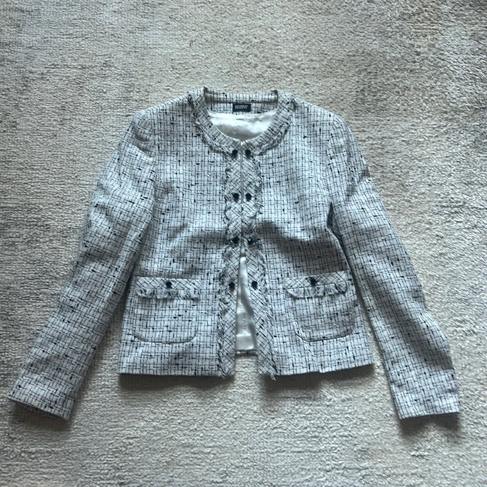 European designer tweed ruffle button detail
